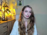 Hey, I’m Nina – blonde hair, green eyes, and tattoos that love to tell their own stories. My taste in music? Somewhere between Doja Cat’s groove and Rammstein’s fire ? I adore singing, dancing, and just vibing with the right energy. Sometimes I’m your sweet daydream, sometimes your wild rock chick – depends on which song is playing ?